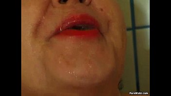 Chubby granny pissing in the shower